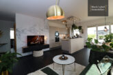 Fantastic penthouse with approx. 120 m² roof garden and water view - Living area with open kitchen
